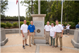 Council Members and Monument Association Director by Eagle Statue