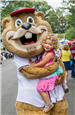 Braves Mascot Holding Child