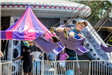 Children Riding a Ride at the Festival