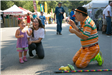 Clown Blows Bubbles at Festival