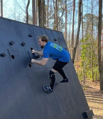 Man climbing an Olympus Wall