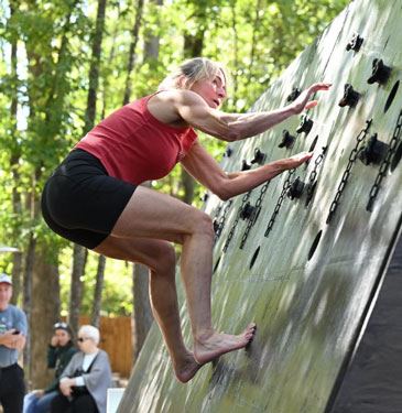 Amy Massey climbing the wall